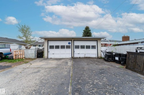 Two-car detached garage with white paneled doors - 13231 74 Street, Edmonton, AB - Outdoor