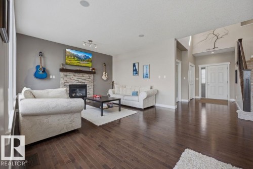 5 Krahn Court, Leduc, AB - Indoor Photo Showing Living Room With Fireplace