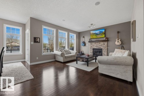 5 Krahn Court, Leduc, AB - Indoor Photo Showing Living Room With Fireplace