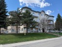 Multi-story building featuring a stucco exterior with multiple balconies and a sloped roofline - 309 10610 76 Street, Edmonton, AB  - Outdoor 