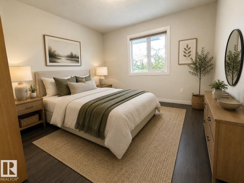Neutral-toned bedroom featuring dark wood-finish flooring, a contemporary window, and recessed lighting - 309 10610 76 Street, Edmonton, AB - Indoor Photo Showing Bedroom