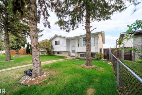 Split-level residence featuring white siding and a prominent bay window - 1771 37 Street, Edmonton, AB - Outdoor