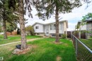 Split-level residence featuring white siding and a prominent bay window - 1771 37 Street, Edmonton, AB  - Outdoor 