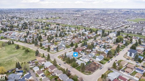 Residential neighborhood featuring mature trees and a mix of single-family homes - 1771 37 Street, Edmonton, AB - Outdoor With View