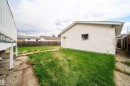 Detached garage featuring horizontal siding and a side entry door - 1771 37 Street, Edmonton, AB  - Outdoor With Exterior 