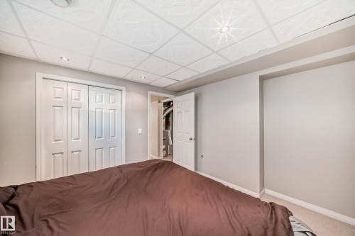 Bedroom featuring neutral wall paint, recessed lighting, and a patterned drop ceiling - 2339 28B Ave Avenue, Edmonton, AB - Indoor