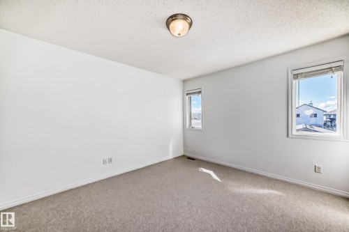 Light gray carpeting and white painted walls - 2339 28B Ave Avenue, Edmonton, AB - Indoor Photo Showing Other Room