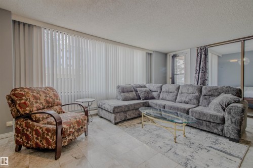 202 8340 Jasper Avenue, Edmonton, AB - Indoor Photo Showing Living Room