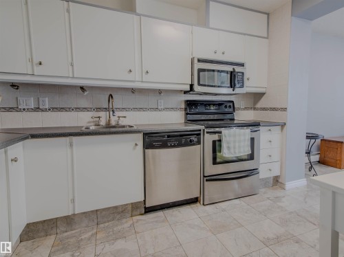 202 8340 Jasper Avenue, Edmonton, AB - Indoor Photo Showing Kitchen With Double Sink