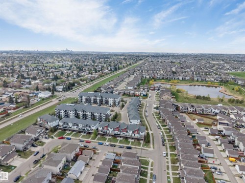 Aerial perspective showcasing a residential community with varied housing styles - 3340 15A Avenue, Edmonton, AB - Outdoor With View