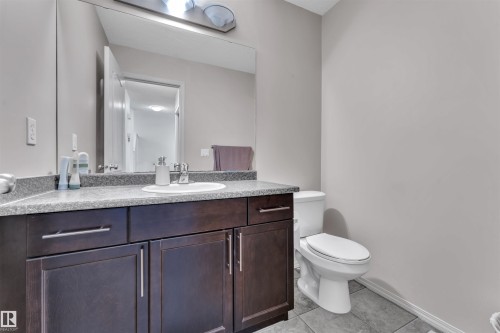 Bathroom with light tile patterned flooring and vanity - 6152 13 Avenue, Edmonton, AB - Indoor Photo Showing Bathroom