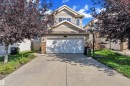 Traditional-style house with stone siding and concrete driveway - 6152 13 Avenue, Edmonton, AB  - Outdoor 