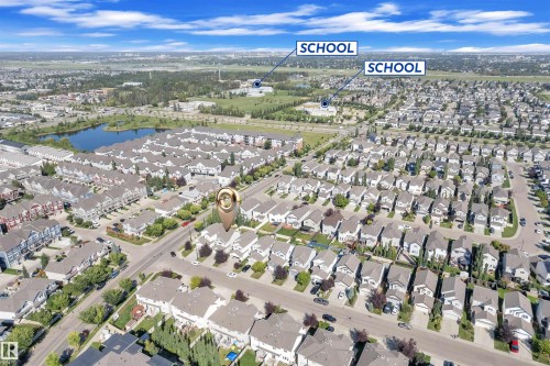View of property location featuring nearby suburban area and a large body of water - 6152 13 Avenue, Edmonton, AB - Outdoor With View