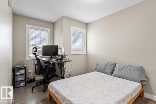 Neutral-toned room featuring a light-colored wall finish and two windows with white blinds - 236 39 Avenue, Edmonton, AB - Indoor