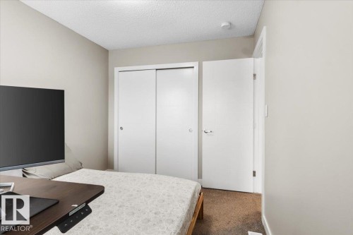 Neutral wall paint with textured ceiling - 236 39 Avenue, Edmonton, AB - Indoor Photo Showing Bedroom