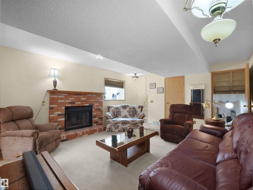 10711 24 Avenue, Edmonton, AB - Indoor Photo Showing Living Room With Fireplace