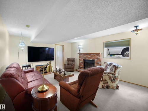 10711 24 Avenue, Edmonton, AB - Indoor Photo Showing Living Room With Fireplace