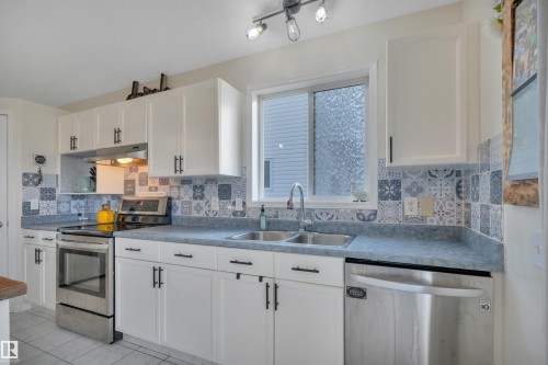 10 Campbell Road, Leduc, AB - Indoor Photo Showing Kitchen With Double Sink