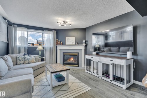 10 Campbell Road, Leduc, AB - Indoor Photo Showing Living Room With Fireplace