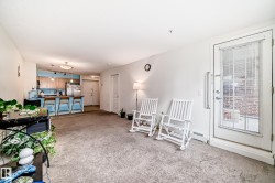Open concept living space with wall-to-wall carpeting - 