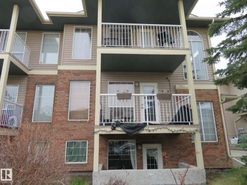 Multi-level residential building featuring brick and siding facade - 2945 26 Street, Edmonton, AB - Outdoor With Balcony With Facade