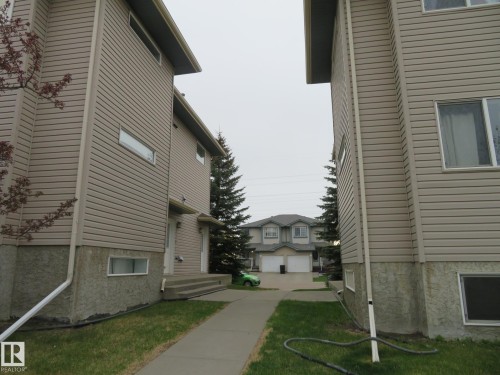 Two-story structures featuring horizontal siding and stucco foundations - 2945 26 Street, Edmonton, AB - Outdoor