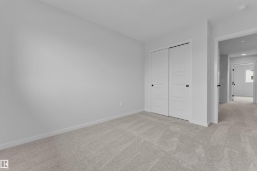 Neutral-toned carpeting throughout - 17330 6A Street Ne, Edmonton, AB - Indoor Photo Showing Other Room