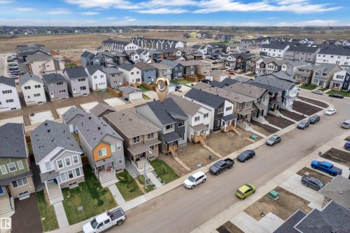 Residential neighborhood with a variety of modern home styles and ample street parking - 17330 6A Street Ne, Edmonton, AB - Outdoor With View