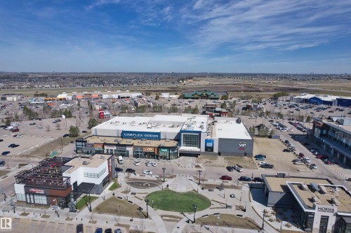 Expansive commercial development featuring multiple retail buildings and extensive parking areas - 2036 Ainslie Link Link, Edmonton, AB - Outdoor With View