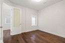 Room featuring wood-finish flooring, white baseboards, and neutral wall tones - 2036 Ainslie Link Link, Edmonton, AB  - Indoor Photo Showing Other Room 
