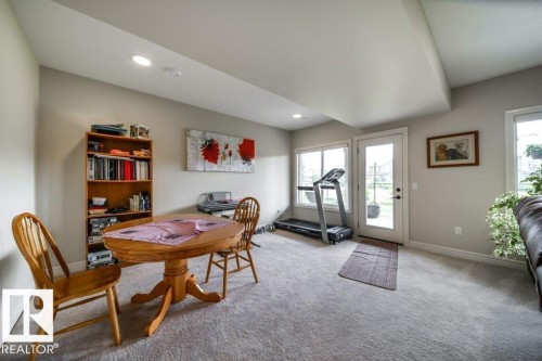 Carpeted recreation room with recessed lighting and crown molding - 3 8050 Orchards Green, Edmonton, AB - Indoor