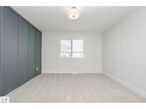 Room with light-colored carpeting and white walls - 6302 Dansereau Crescent, Beaumont, AB - Indoor Photo Showing Other Room