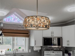 Decorative drum pendant light with circular accents - 