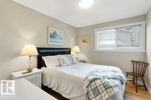This room features light-colored walls and a window with blinds, allowing for natural light - 7 Ash Place, St. Albert, AB - Indoor Photo Showing Bedroom