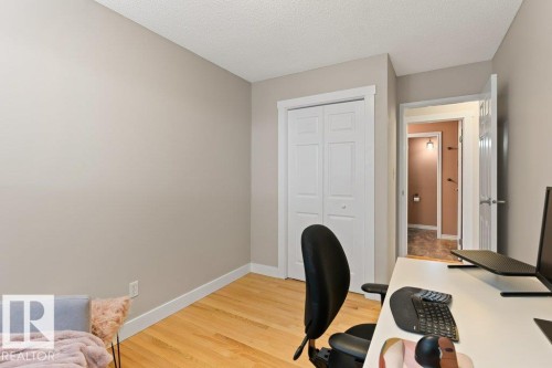 This room features light-colored walls, wood flooring, and white trim - 7 Ash Place, St. Albert, AB - Indoor Photo Showing Office