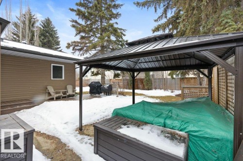 The property features an outdoor gazebo with a metal roof and an adjacent wooden lattice privacy screen - 7 Ash Place, St. Albert, AB - Outdoor With Deck Patio Veranda