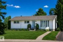 White siding exterior with a pitched roof - 10231 46 Street, Edmonton, AB 