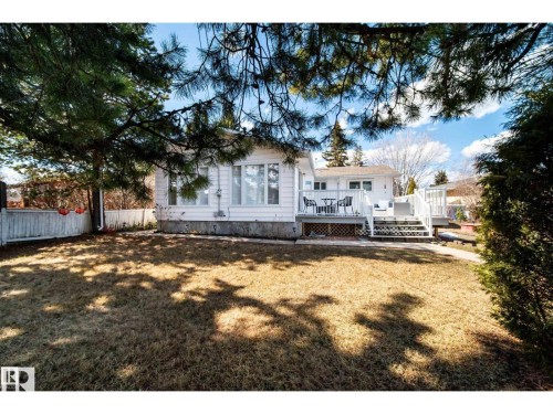Rear exterior featuring a white siding finish - 10231 46 Street, Edmonton, AB 