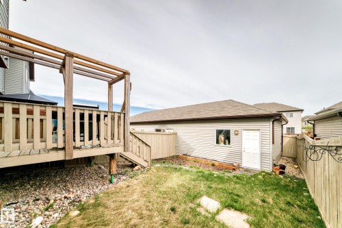 Rear deck with pergola structure, offering direct access to the yard - 328 Watt Boulevard, Edmonton, AB - Outdoor With Exterior