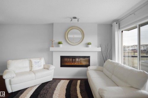 1702 Chapman Way, Edmonton, AB - Indoor Photo Showing Living Room With Fireplace