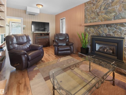 9202 117 Street, Edmonton, AB - Indoor Photo Showing Living Room With Fireplace