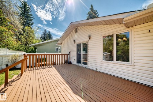 Expansive wood-finish deck with a matching railing system - 79 Broadview Crescent, St. Albert, AB - Outdoor With Deck Patio Veranda With Exterior