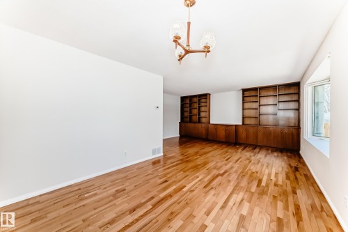 Wood-finish flooring throughout - 79 Broadview Crescent, St. Albert, AB - Indoor Photo Showing Other Room