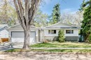 White siding exterior with a partial stone facade and a two-car garage - 79 Broadview Crescent, St. Albert, AB  - Outdoor 