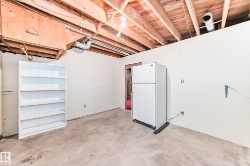 Unfinished basement space featuring exposed wood joists and concrete flooring - 79 Broadview Crescent, St. Albert, AB - Indoor