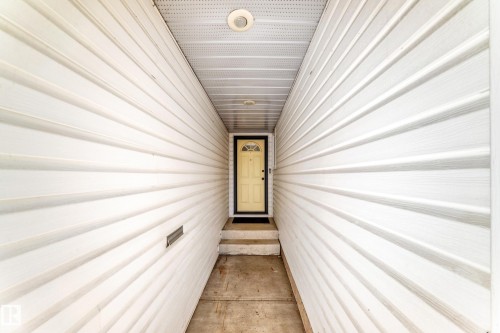 Covered entryway with light-toned siding, concrete pathway, and a recessed ceiling light - 79 Broadview Crescent, St. Albert, AB -  Photo Showing Other Room