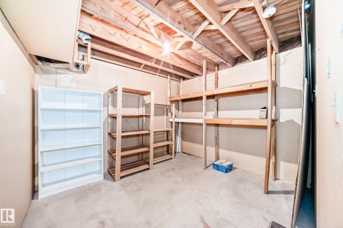 Unfinished basement space featuring exposed wood joists and concrete flooring - 79 Broadview Crescent, St. Albert, AB - Indoor