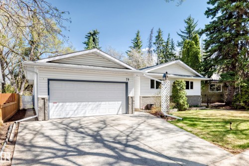 White siding exterior with a prominent two-car garage - 79 Broadview Crescent, St. Albert, AB - Outdoor