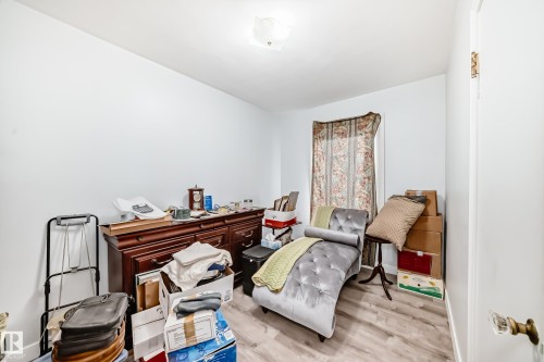 Light gray wall paint with wood-finish flooring - 11303 60 Street, Edmonton, AB - Indoor