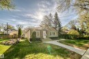 Single-story residence featuring light green siding and dark trim - 11303 60 Street, Edmonton, AB  - Outdoor 